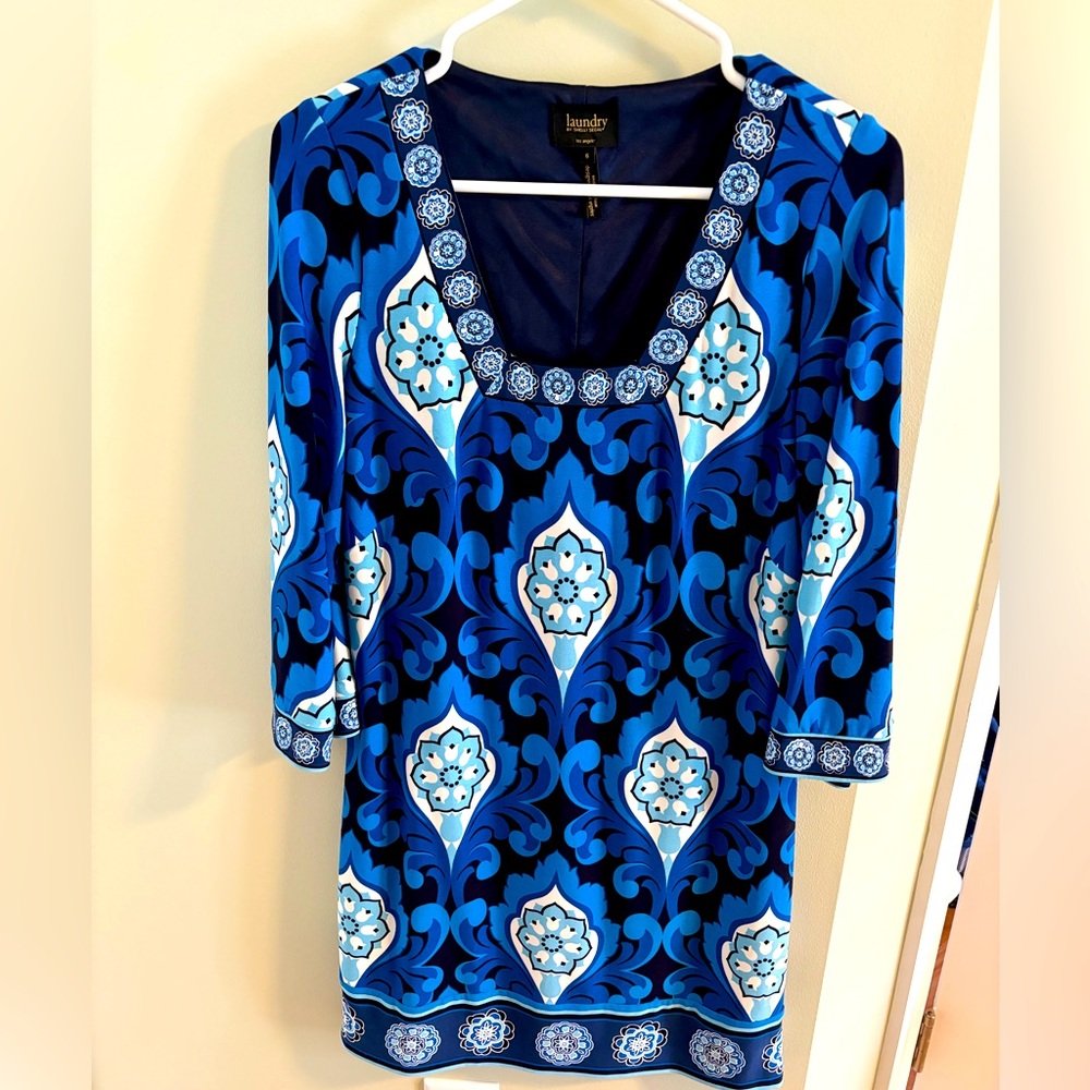 Blue and black shift dress with 3/4 sleeves.